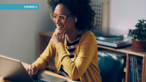 Professional smiling and working on a laptop