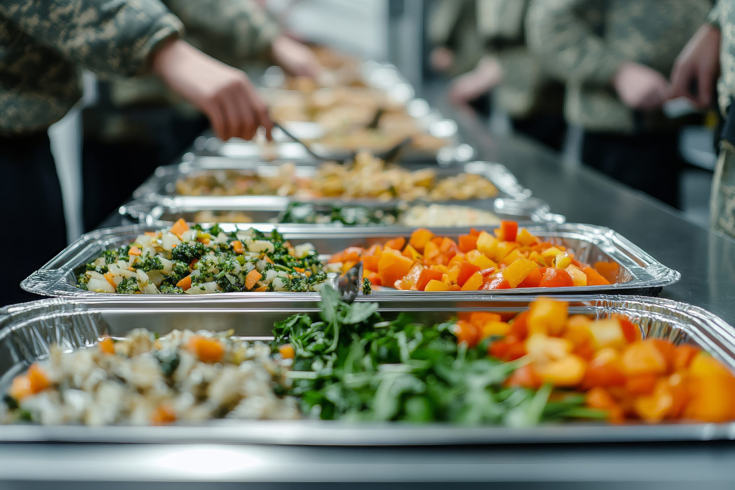 Military service members in uniform going through the foodservice line at a commissary.